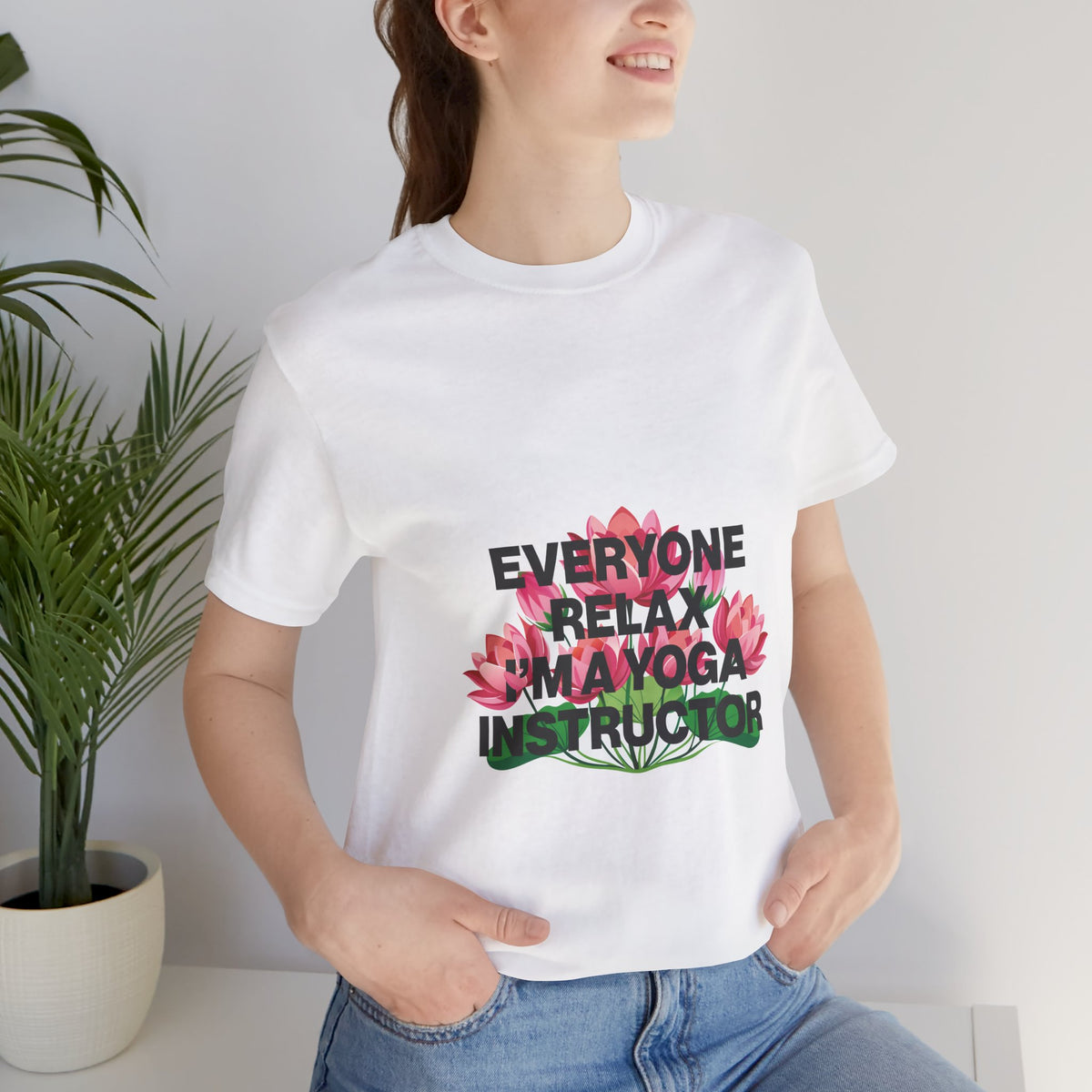 Person wearing a white t-shirt with a humorous yoga instructor design.
